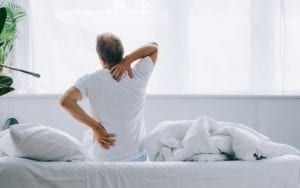 Man holding the neck and back pain